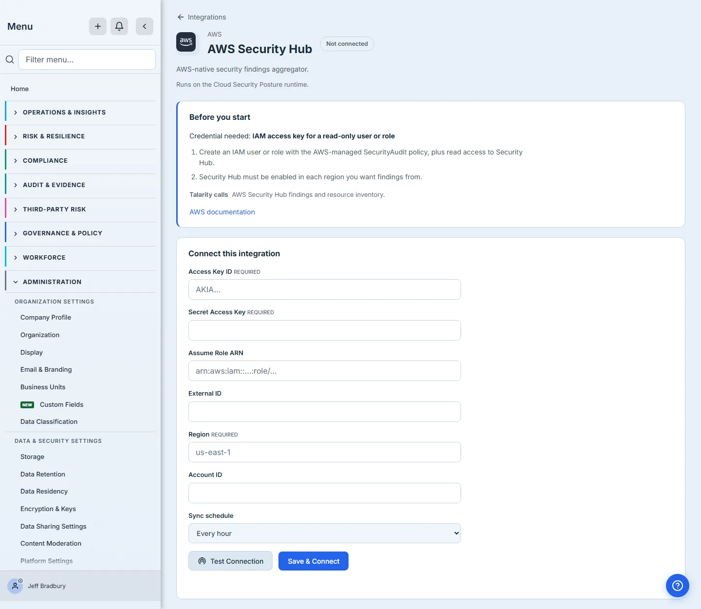The AWS Security Hub setup page reached from the connector drawer: a Not connected badge, a "Before you start" panel naming the IAM access key and the SecurityAudit policy needed to create it, and a Connect this integration form with Access Key ID, Secret Access Key and Region marked Required, optional Assume Role ARN, External ID and Account ID, a sync schedule, and Test Connection beside Save & Connect.