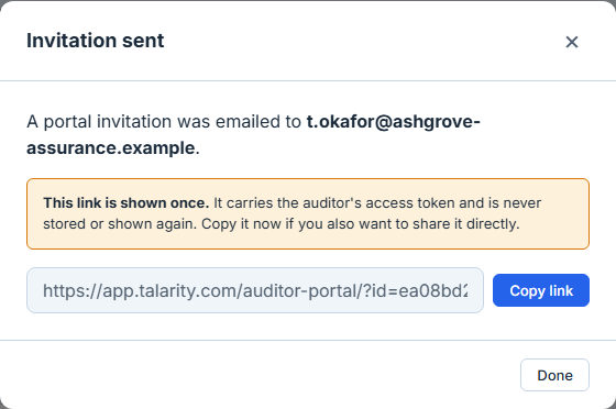The success dialog after an invitation is sent. It is headed "Invitation sent" and states that a portal invitation was emailed to t.okafor@ashgrove-assurance.example. An amber panel beneath says "This link is shown once." and explains that the link carries the auditor’s access token, is never stored or shown again, and should be copied now if it is also to be shared directly. Below that the portal URL sits in a read-only text box, truncated at the box’s width, with a Copy link button beside it, and a Done button closes the dialog. This is the only time the credential is ever shown.